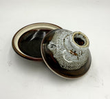 Covered pottery dish