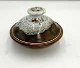 Covered pottery dish