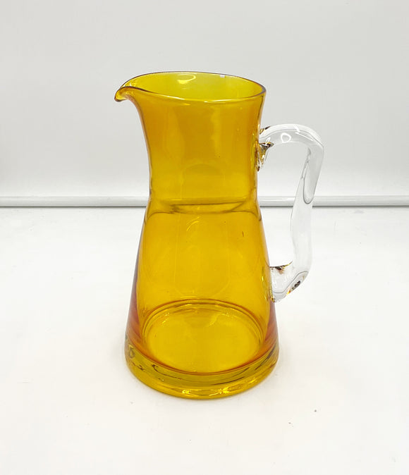 Yellow glass pitcher