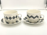 Pair Black/white cups and saucer