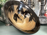 Black patterned pottery bowl