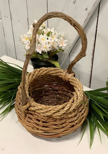 Basket with twisted wood handle