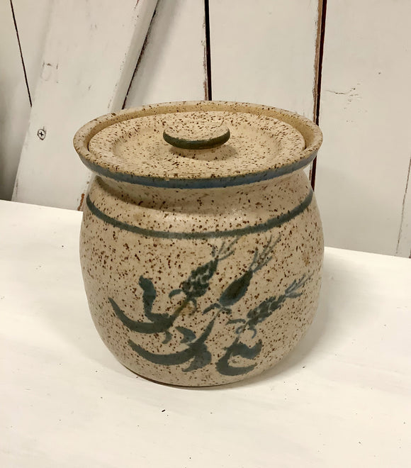 Speckled, lidded pottery jar
